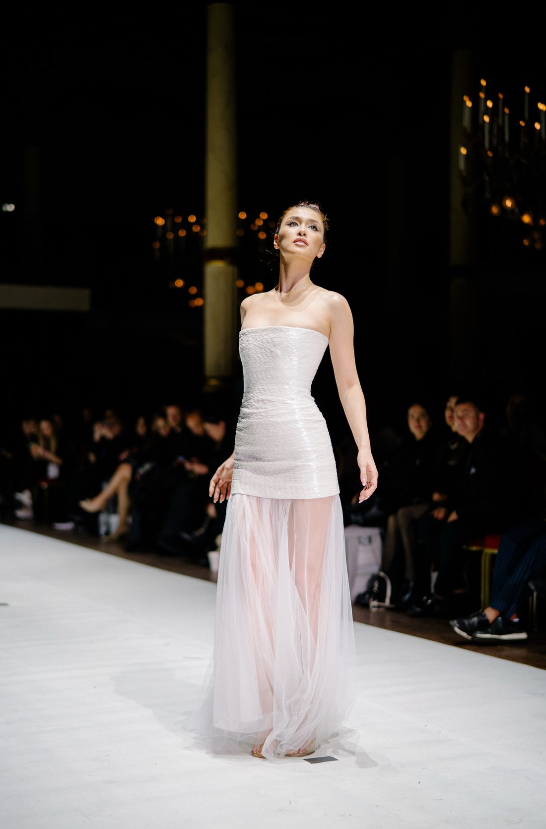 Nicole Borromeo walking the runway in a sequin and tulle gown